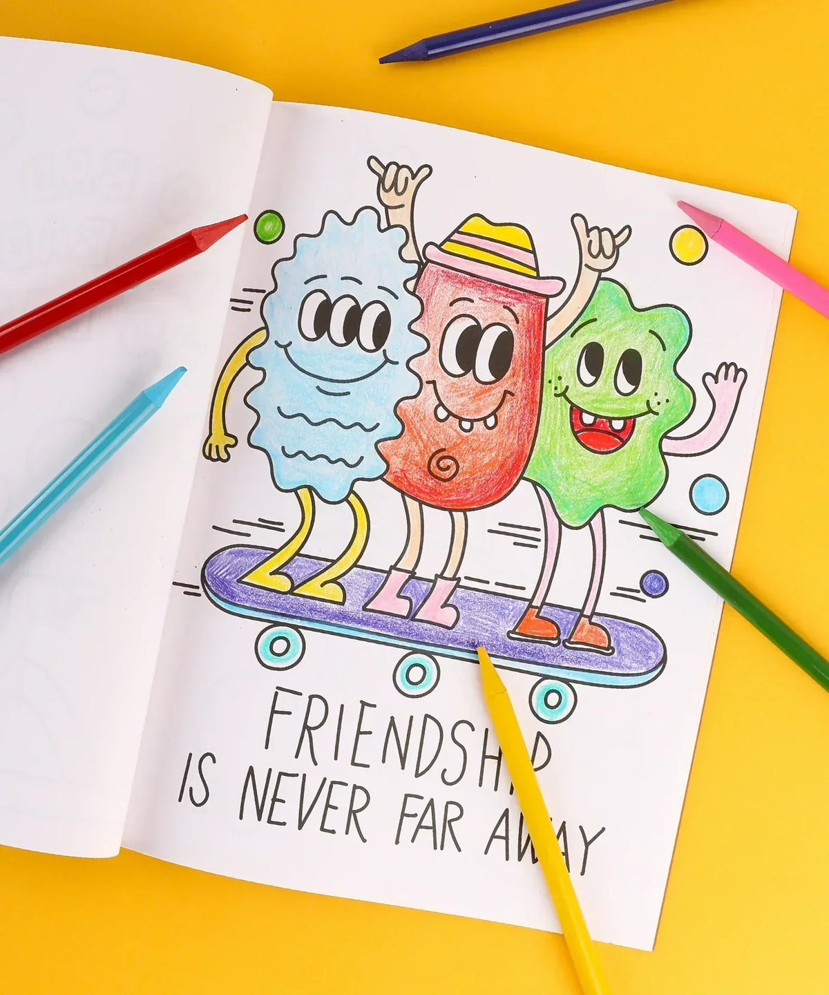 Colorful cartoon characters on skateboard coloring page with markers from Dual Tone Brush Tip Acrylic Paint Marker Set With Coloring Book