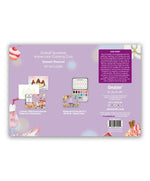 Back view of Grabie Quarterly Watercolor Coloring Club dessert-themed set with watercolor palette and coloring book on purple background