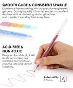Hand holding a red Glitter Gel Ink Pen Set pen drawing a wavy line with colorful pen swatches above.