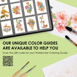 Watercolor Set Of 50 & Coloring Book Bundle with floral color guides, brushes, and partially painted artwork on a light green background