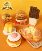 Assorted Grabie Ultimate Stress Relief Squishy toys shaped like food items including burger, chocolate, and dessert treats.