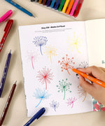 Hand drawing colorful dandelion designs using markers from What to Draw When You Think You Can’t - Plant Edition book