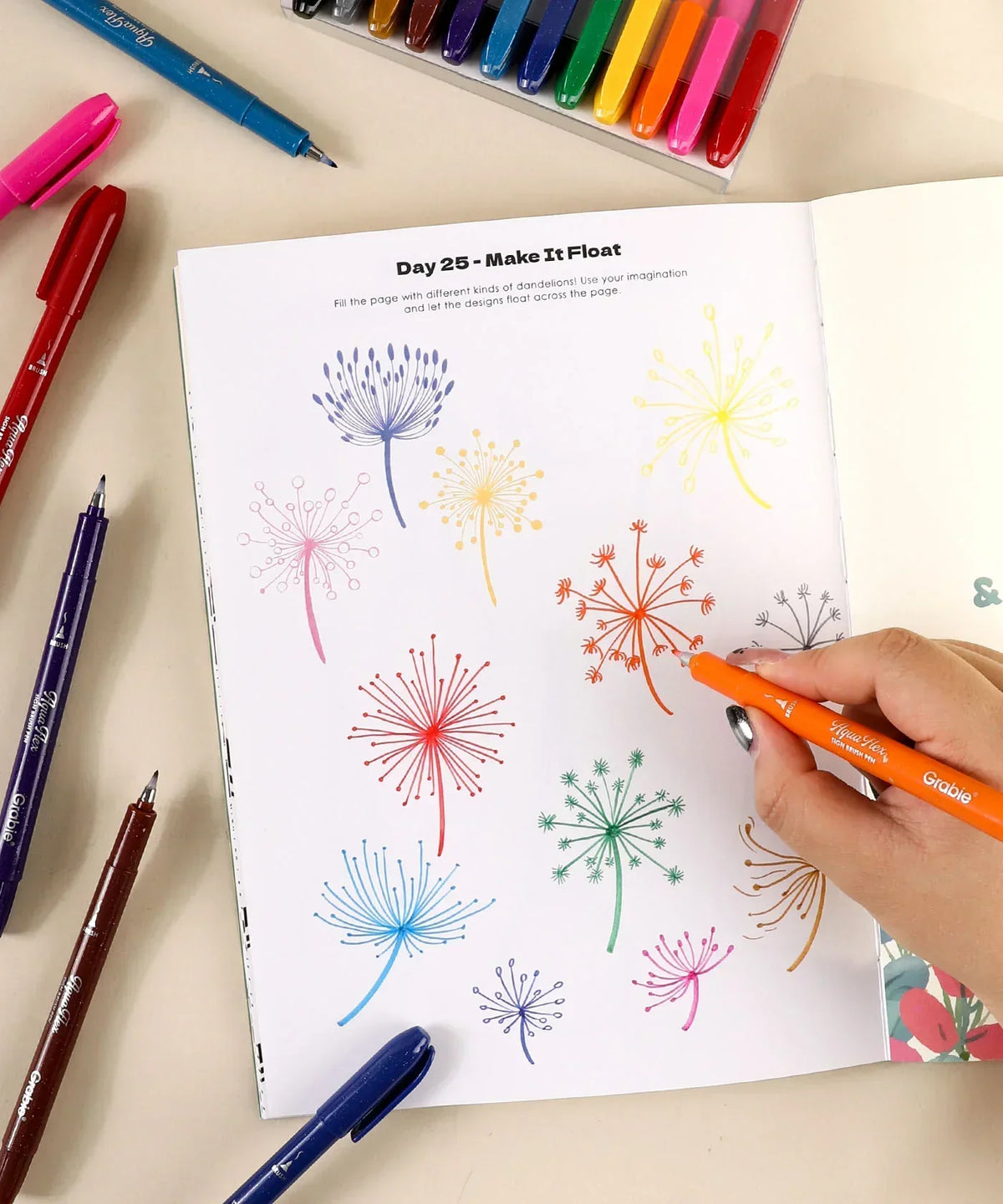 Hand drawing colorful dandelion designs using markers from What to Draw When You Think You Can’t - Plant Edition book