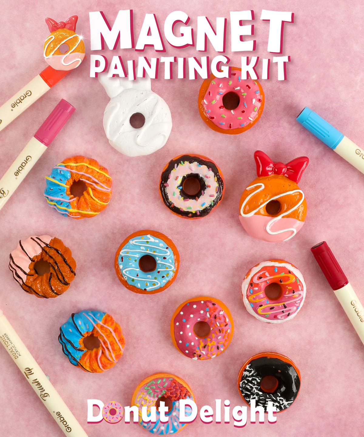 Magnet Painting Kit (DIY Refrigerator Magnet Kit) with colorful donut-shaped magnets and vibrant art supplies on pink background 
