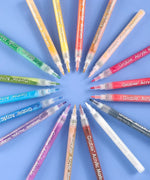 Extra Fine Tip Acrylic Paint Marker Set With Iridescent Glitter Acrylic Paint Marker Set arranged in colorful circle on blue background