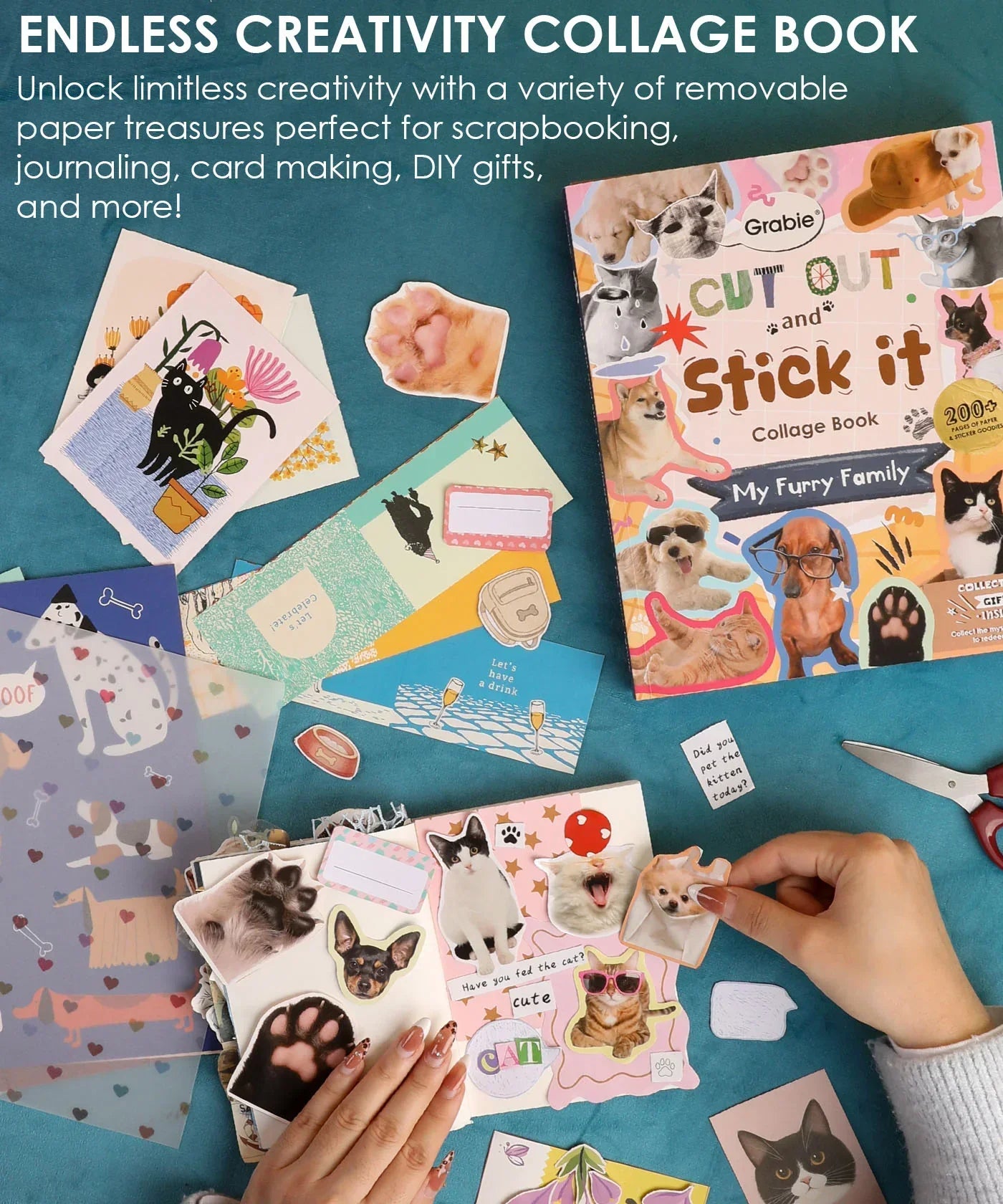 200+ Pages My Furry Family Collage Activity Book with cat and dog stickers, scrapbook supplies, and crafting materials on blue surface