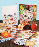 200+ Pages The Flavor Folio Collage Activity Book with colorful food-themed cutouts and scrapbook art supplies on table