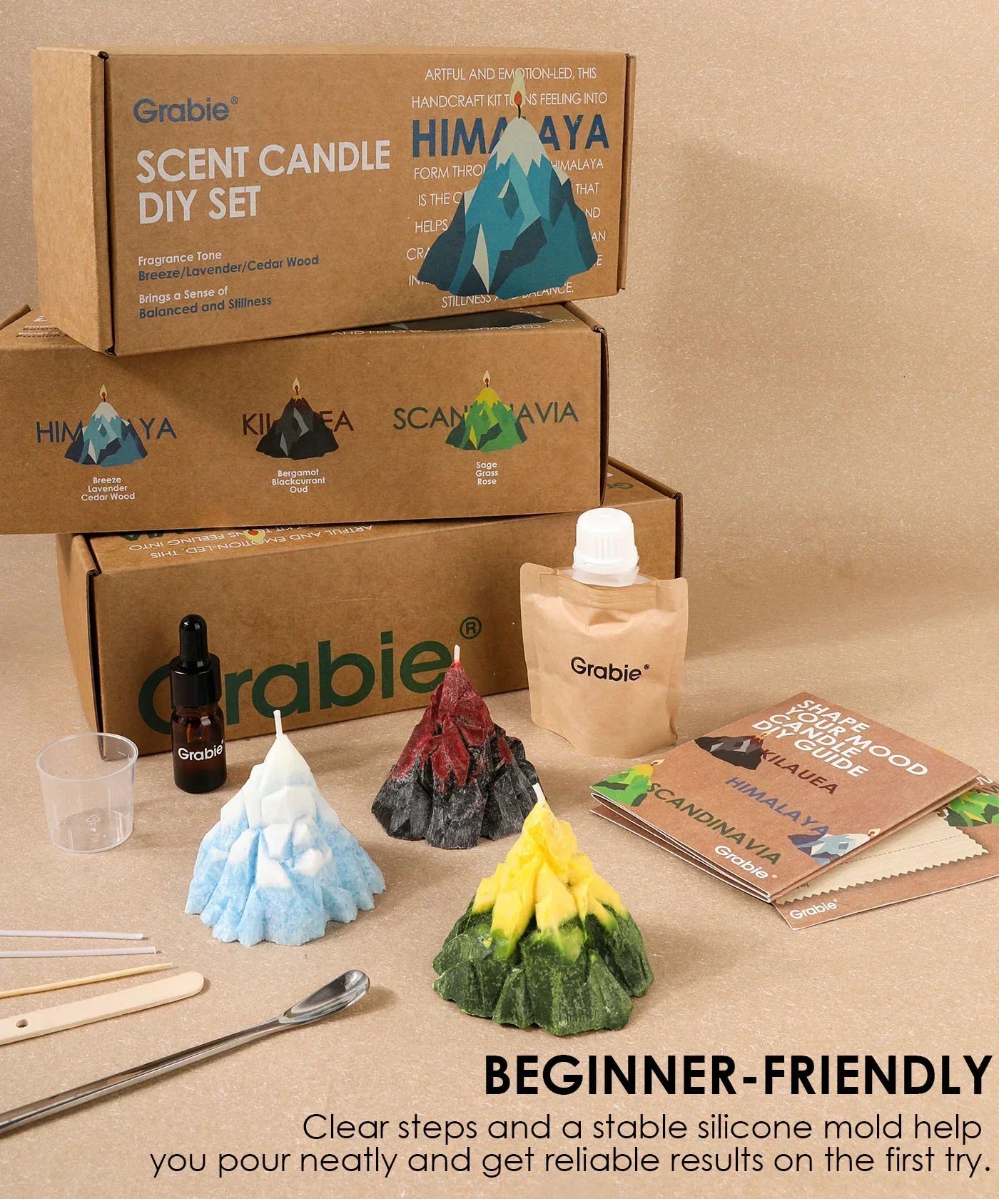 Three colorful handcrafted candles, pour bottle, tools, and packaging of the Scent Candle DIY Set by Grabie