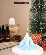 Scent Candle DIY Set with mountain-shaped candle, fragrance oils, pinecones, and festive decorations on display