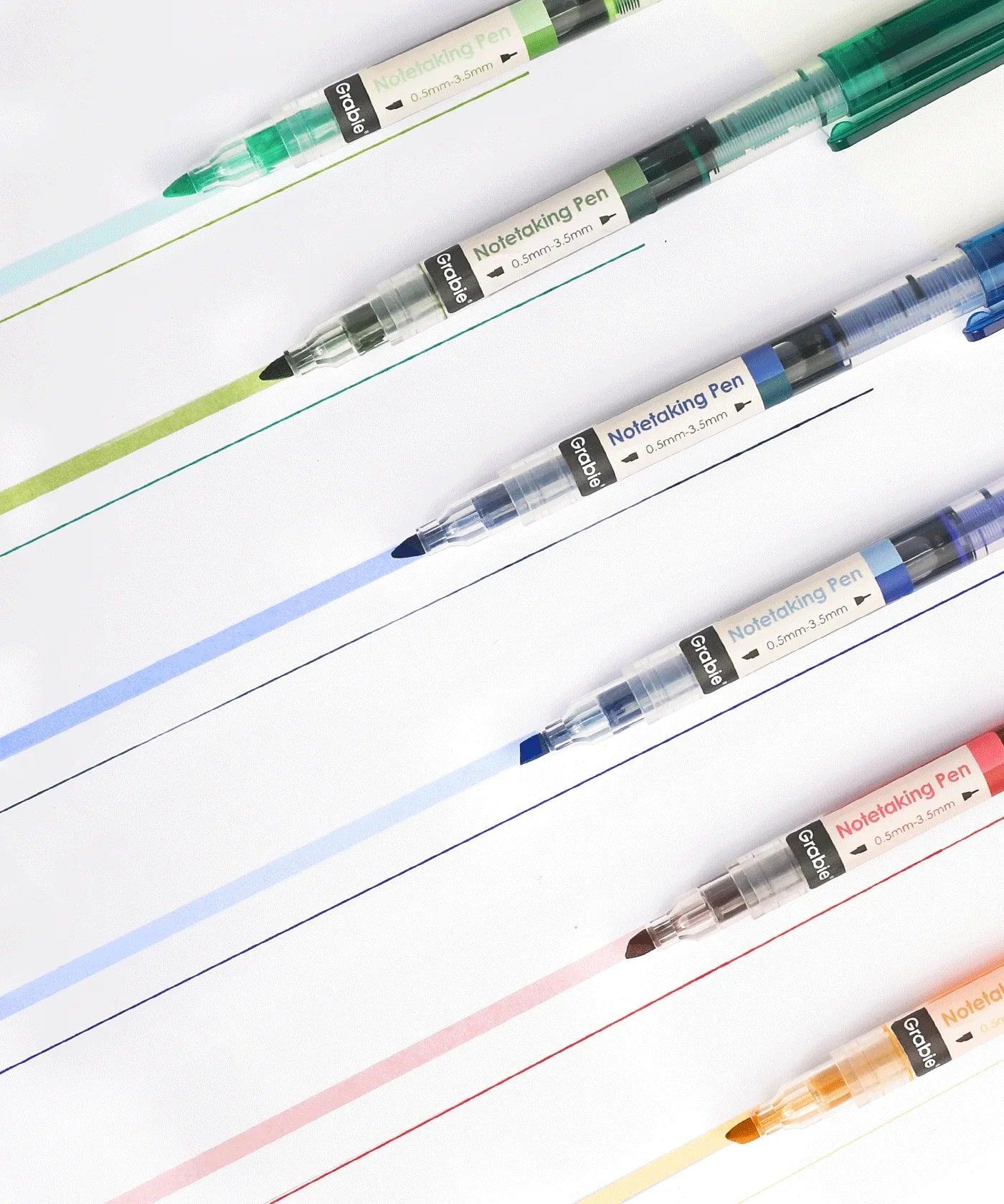 Dual-Tip Notetaking Pen Set Of 6 showing various colored ink lines on white paper for note-taking and journaling.