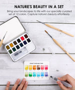 Watercolor Pocket Set Of 12 With Brush - Landscape Colors with paint pans, brushes, and color guide on white wood surface