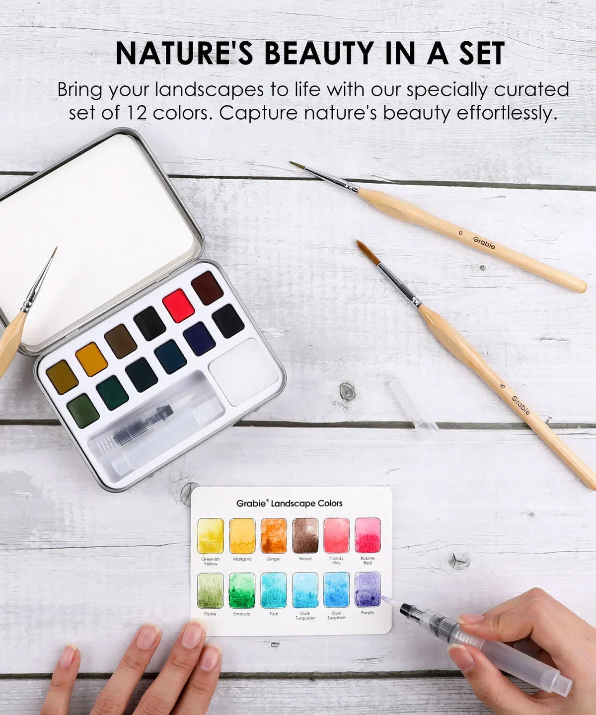 Watercolor Pocket Set Of 12 With Brush - Landscape Colors with paint pans, brushes, and color guide on white wood surface