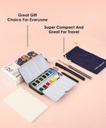 Grabie x @SSavaArt Watercolor 12 Half Pan Deluxe Travel Set with 12 colors, brush, pens, and carrying pouch on pink background