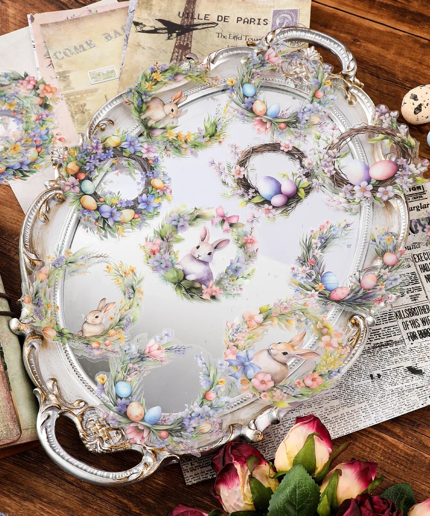 24 Pcs Grabie Exclusive Bunnies and Blooms Sticker Set with floral wreaths, pastel eggs, and cute bunny illustrations on a vintage tray