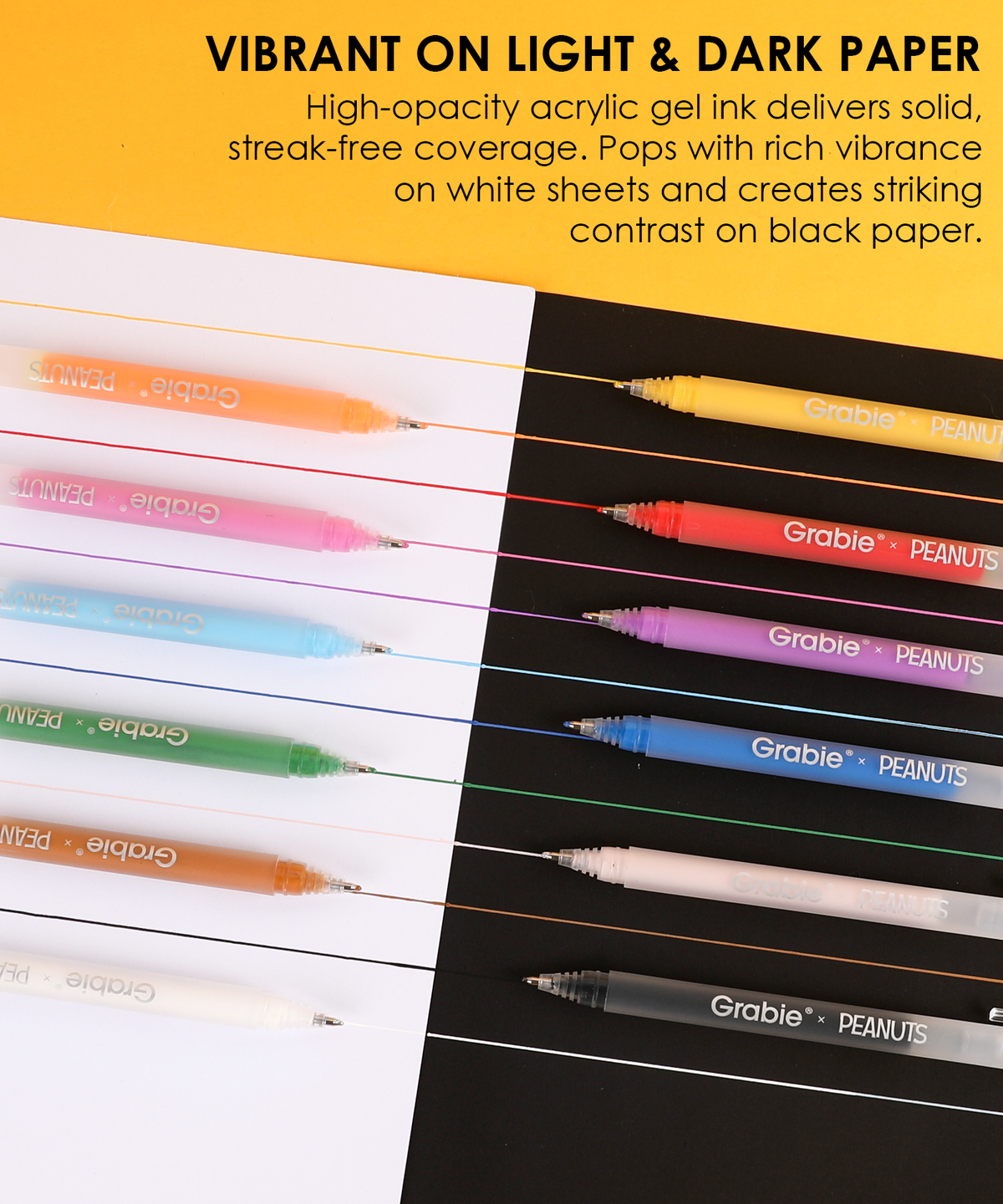 Twelve Peanuts acrylic gel pens displaying vibrant opaque ink coverage on both white and black paper.