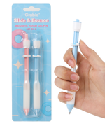 Grabie Slide and Bounce magnetic fidget gel pen set of 2 in blue hanging blister pack with a hand holding one pen.