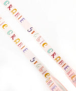 Grabie Waterproof Painter's Tape Set Of 2 with colorful lettering on white tape for art supplies and scrapbook projects.