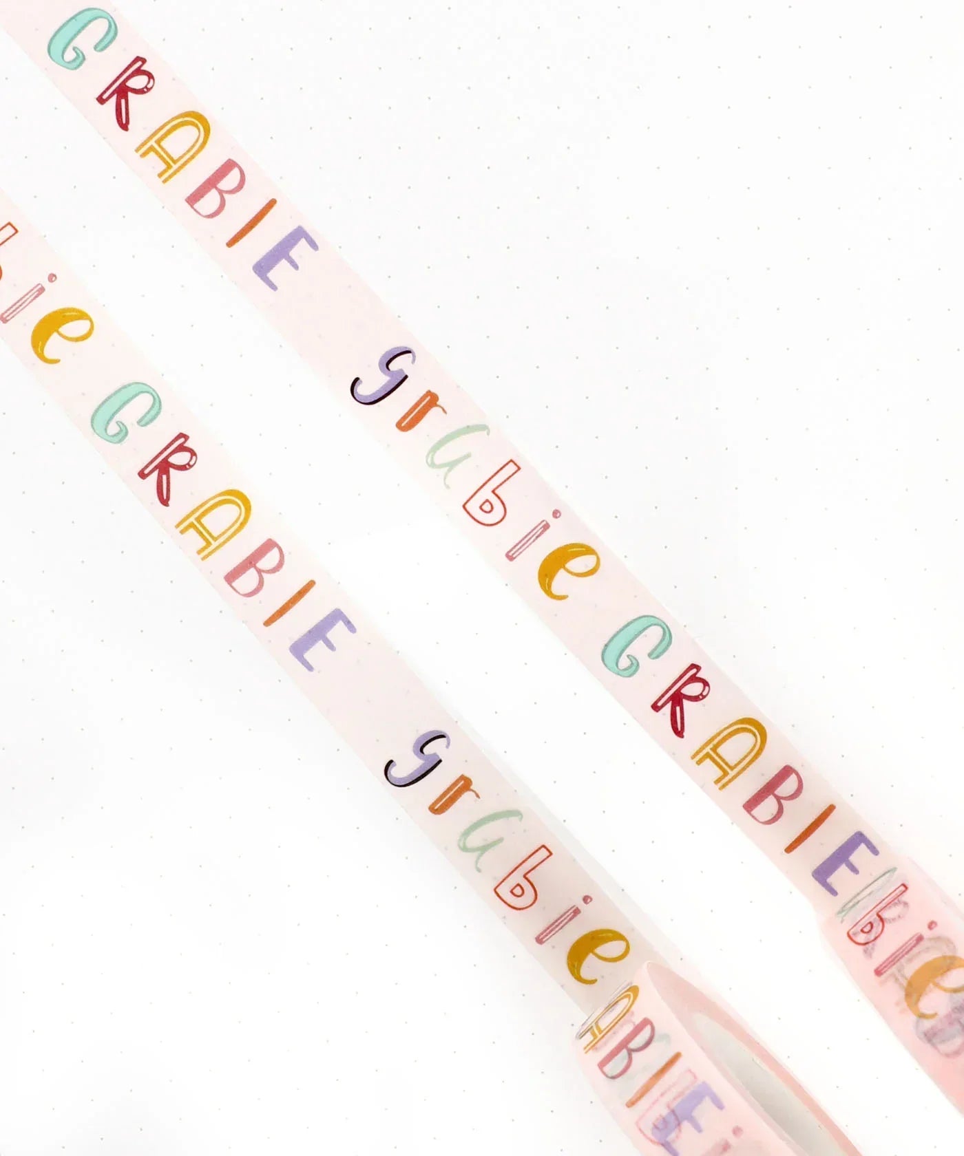 Grabie Waterproof Painter's Tape Set Of 2 with colorful lettering on white tape for art supplies and scrapbook projects.