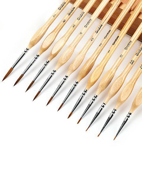 Watercolor Set of 100 With 11 Pcs Miniature Detail Paint Brushes showing fine wooden handles and delicate brush tips arranged in a row.