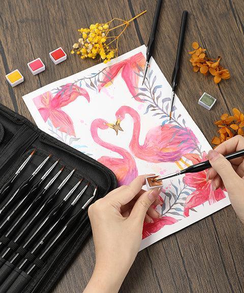 15 Pcs Miniature Detail Brush Set with fine brushes painting watercolor flamingos on paper with paint palette and dried flowers